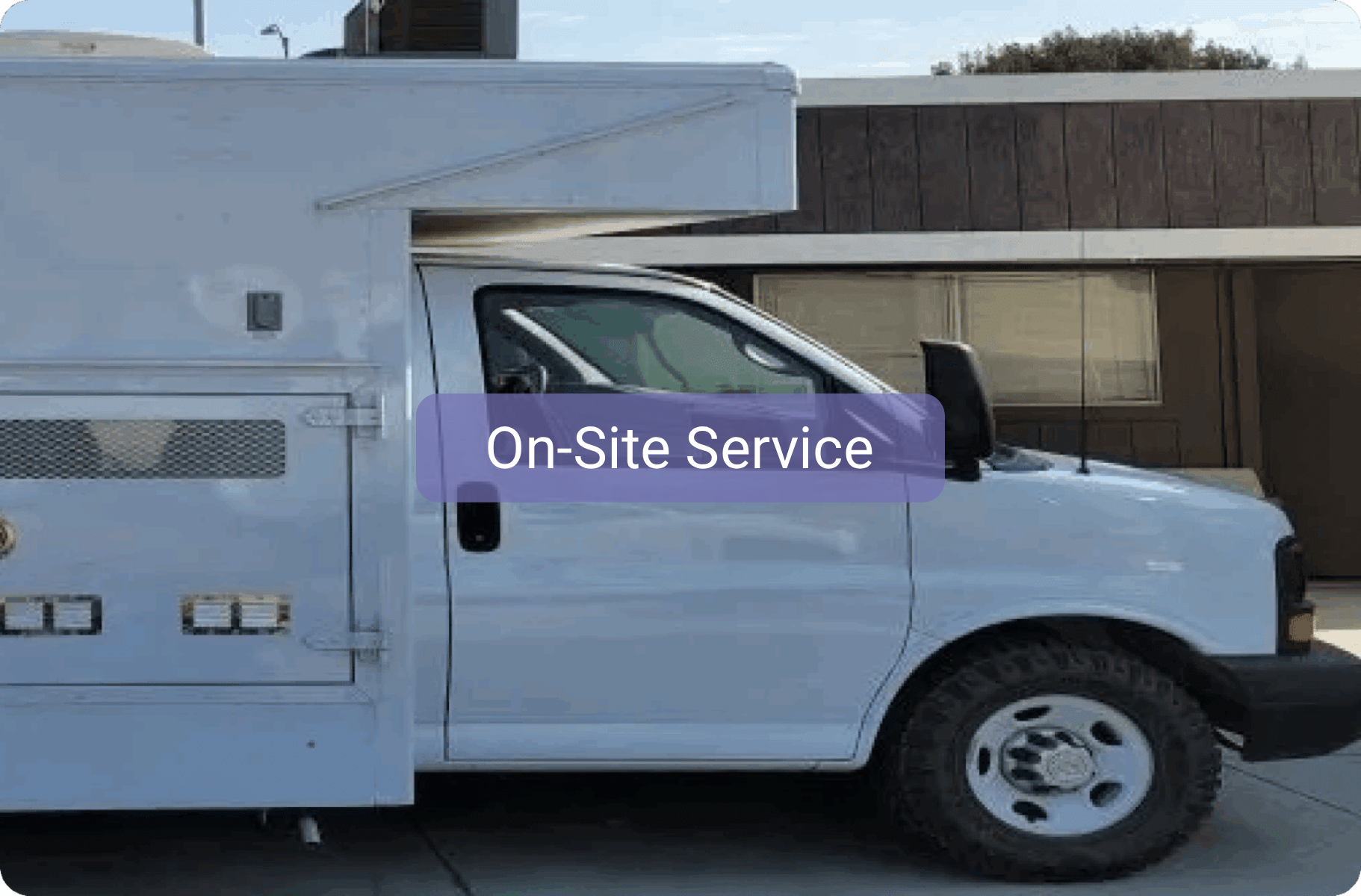White service truck labeled 'On-Site Service' parked outdoors.